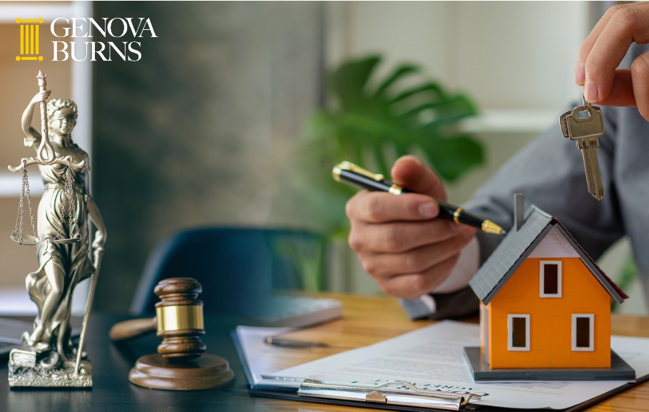 judge holding wooden judge hammer against house background and businessperson documents